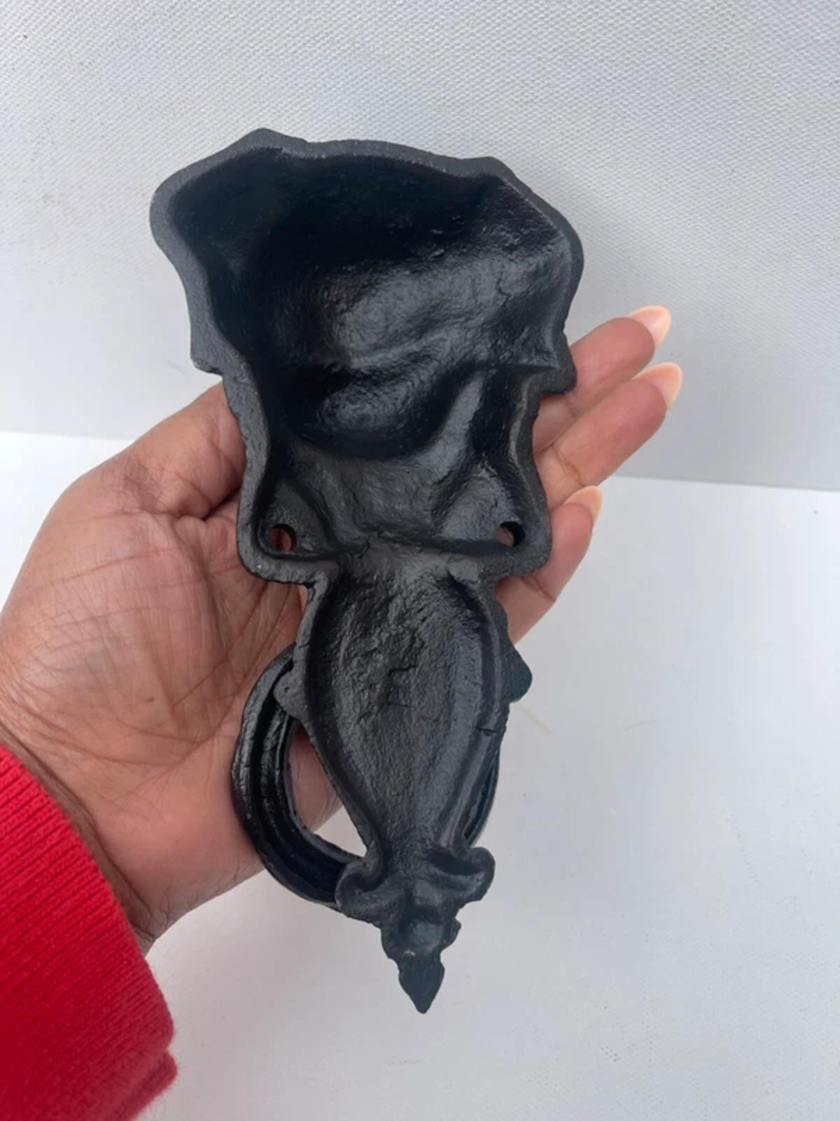 Unique cast iron door knocker showing a dog never used