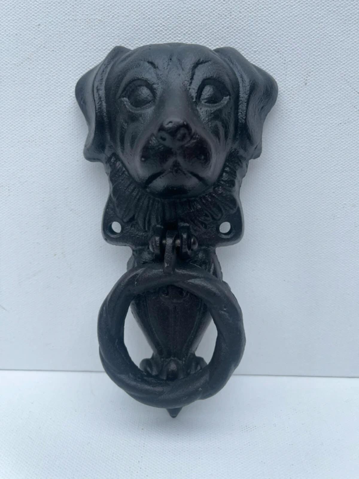 Unique cast iron door knocker showing a dog never used