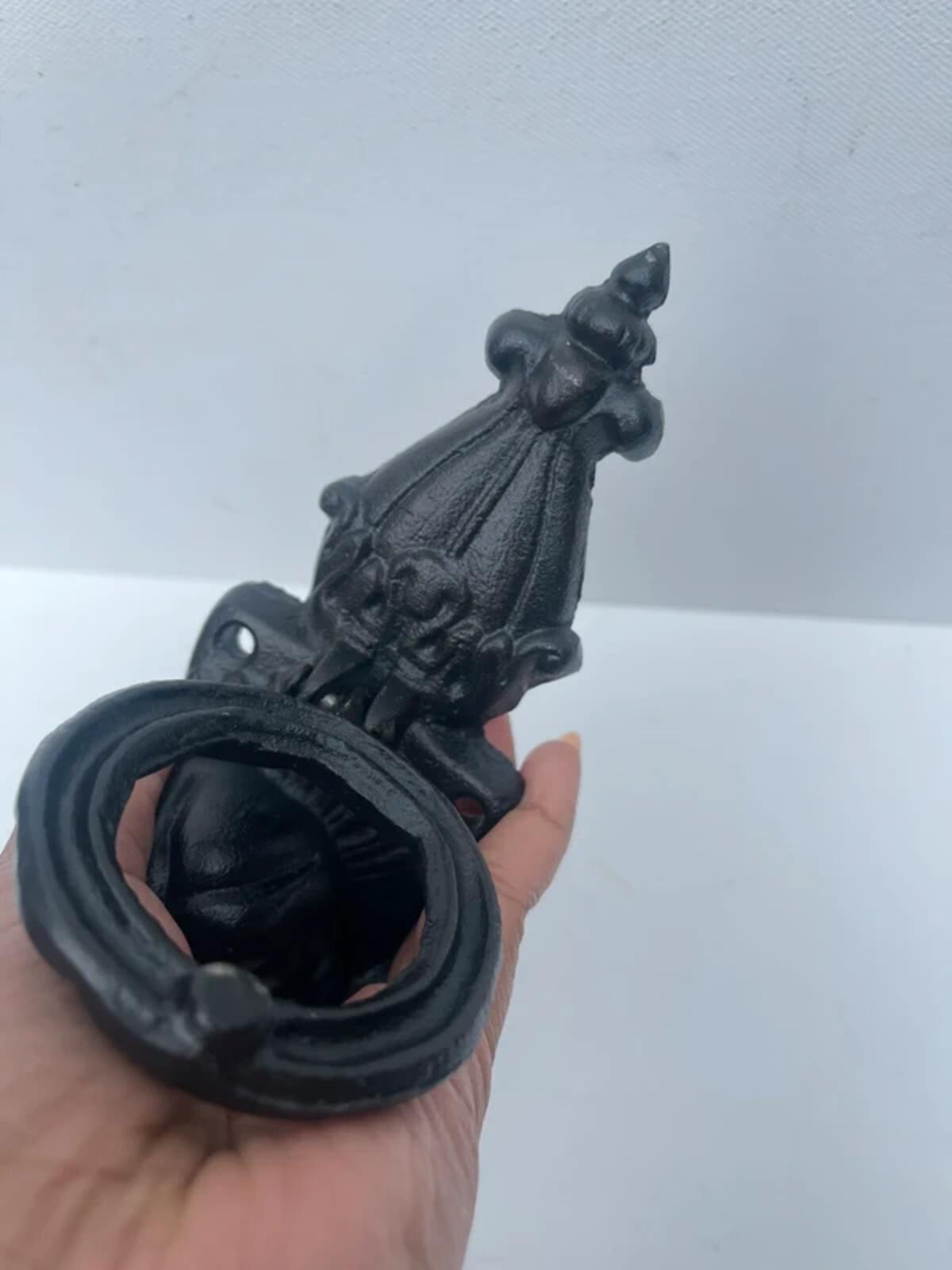 Unique cast iron door knocker showing a dog never used