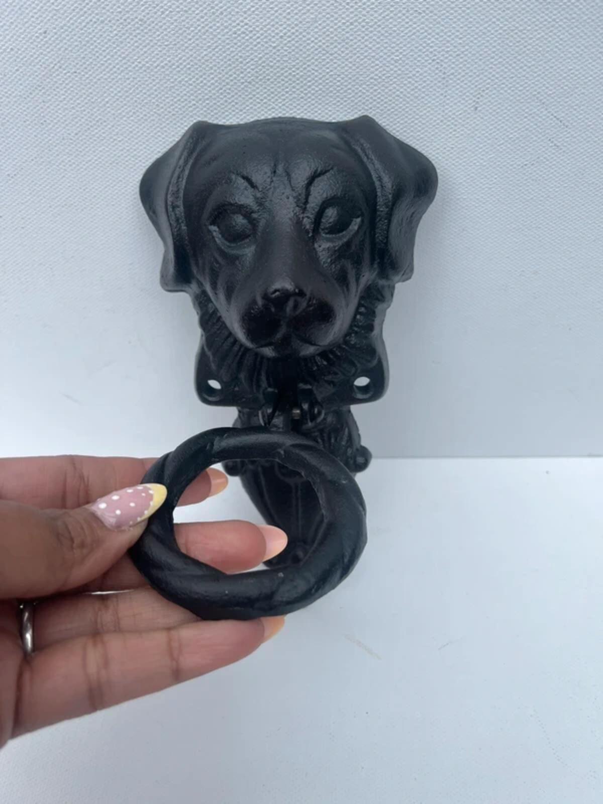 Unique cast iron door knocker showing a dog never used