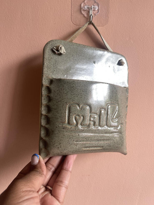 Handmade studio pottery ceramic wall pocket for mail, letters or dried flowers, artisan stoneware wall vase, rustic farmhouse and cottagecore home decor, decorative wall organiser for entryway or kitchen.
