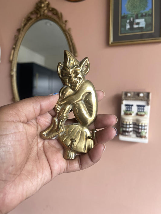 Vintage solid brass pixie wall hook with three hooks, whimsical mid-century key holder, fairy wall hanger, vintage brass home decor for entryway, hallway, kitchen or cottagecore interior styling.