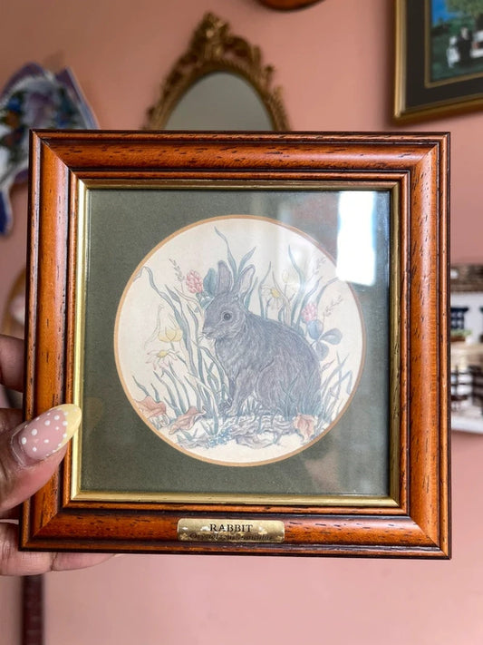 Vintage small framed bunny wall art, charming rabbit print in decorative frame, cottagecore home decor, woodland animal artwork, rustic farmhouse gallery wall accent, whimsical vintage interior styling and nature-inspired display.
