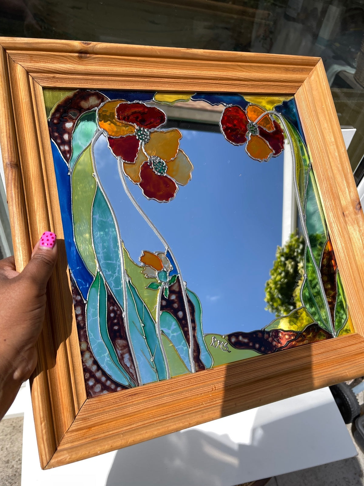 Vintage stained glass floral mirror with poppy design in wooden frame, signed decorative wall mirror, Art Nouveau inspired home decor, cottagecore wall hanging, nature-inspired statement mirror and unique vintage display.