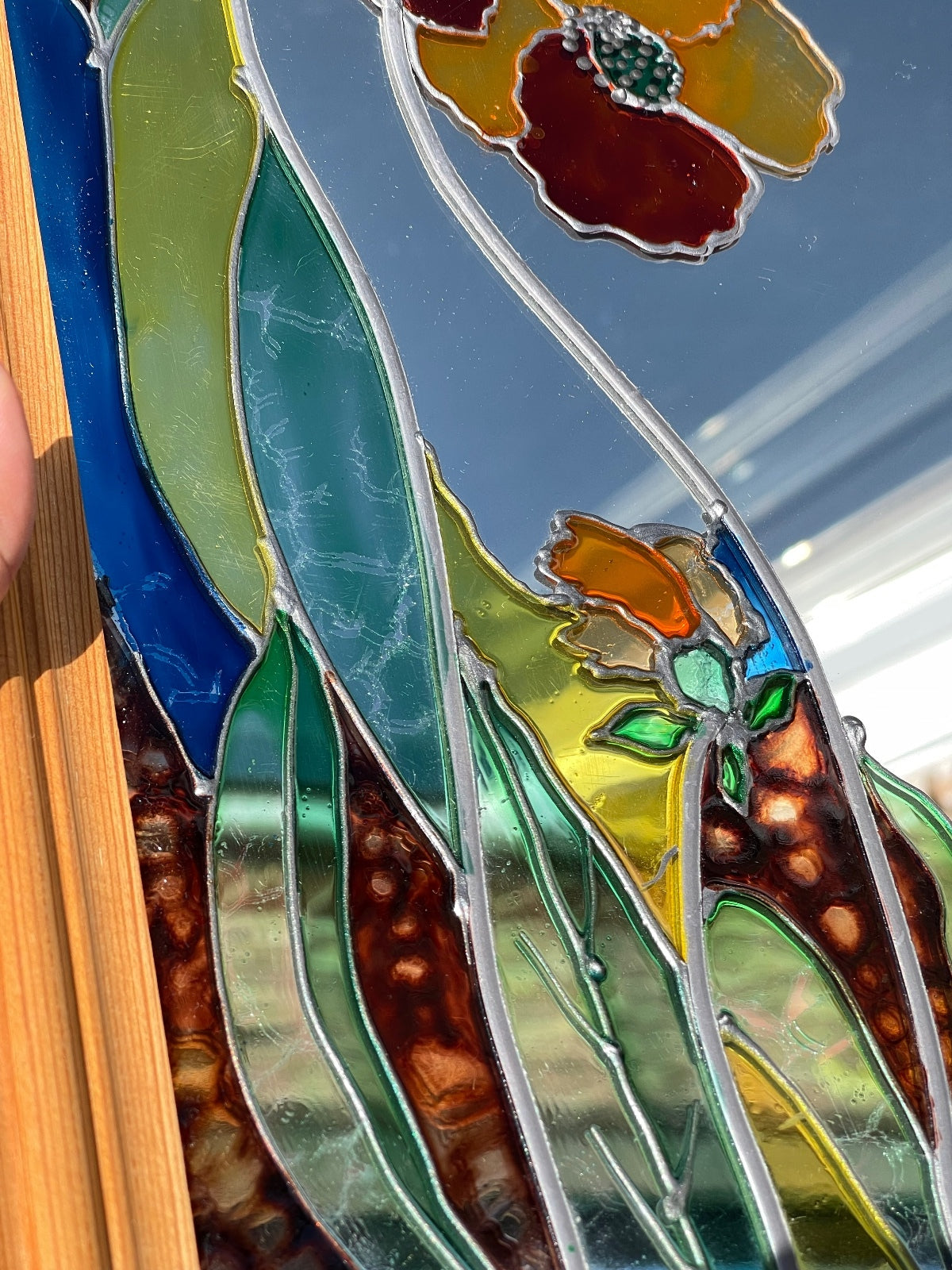 Vintage stained glass floral mirror with poppy design in wooden frame, signed decorative wall mirror, Art Nouveau inspired home decor, cottagecore wall hanging, nature-inspired statement mirror and unique vintage display.